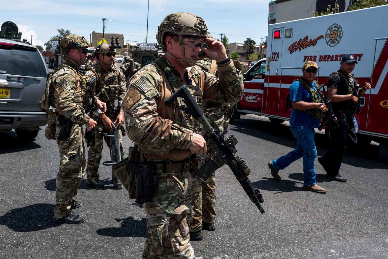 Police swarm the area around the Walmart near Cielo Vista Mall in El Paso, Texas, where the shooting occurred.