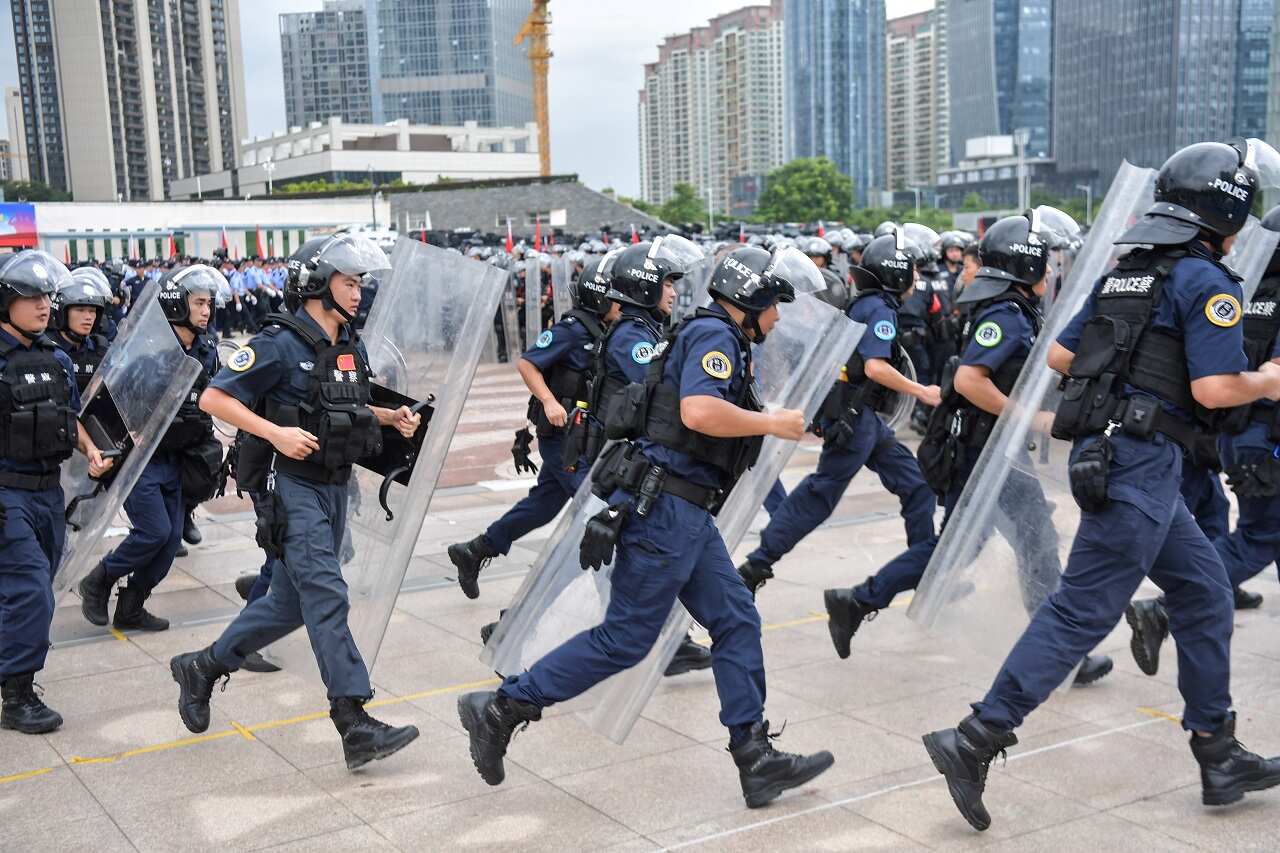 Chinese police officers take part in a drill in Shenzhen in China's southern Guangdong province, across the border from Hong Kong.
