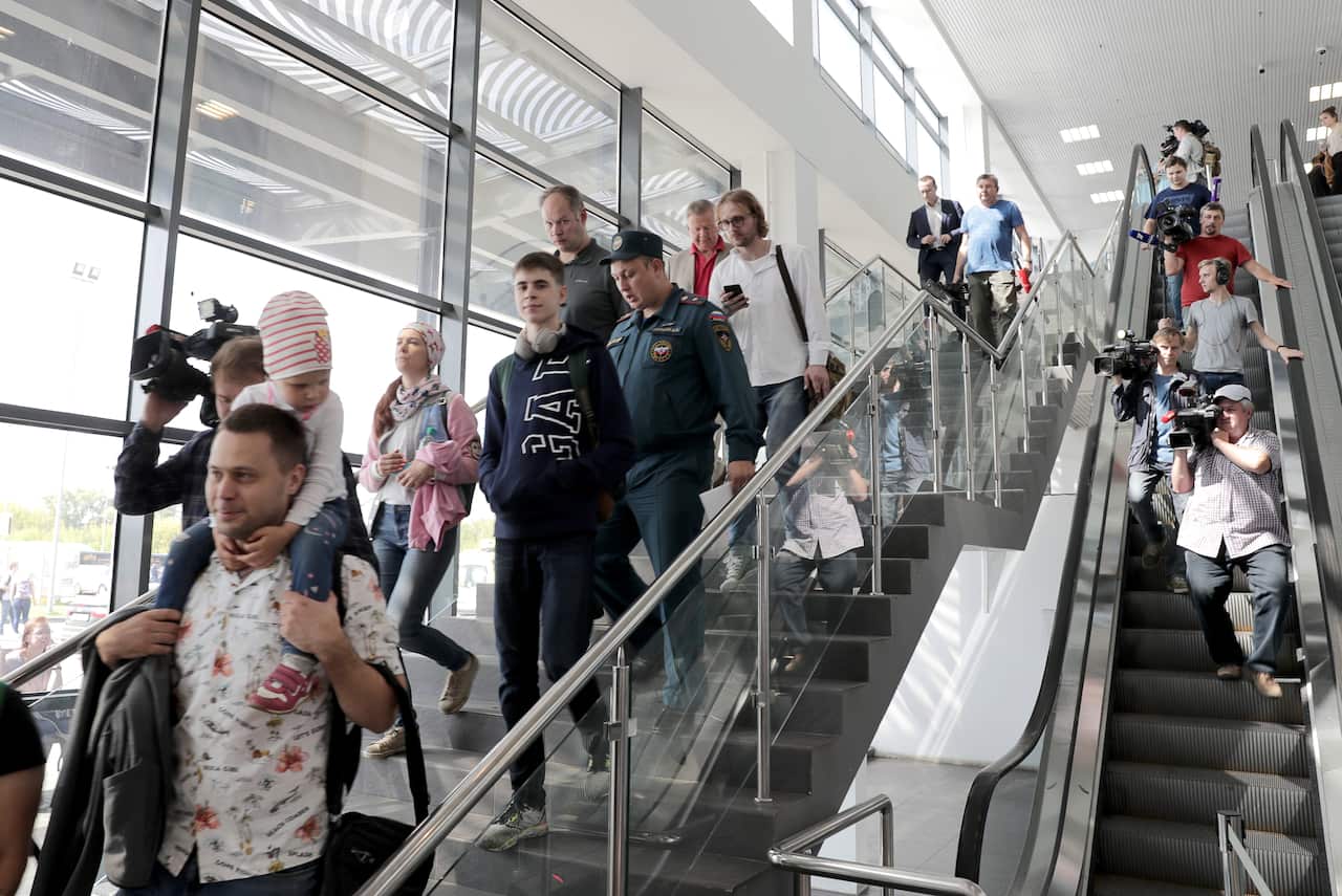 Passengers of a Ural Airlines Airbus A321 plane which made a hard landing in a field near Zhukovsky International Airport.