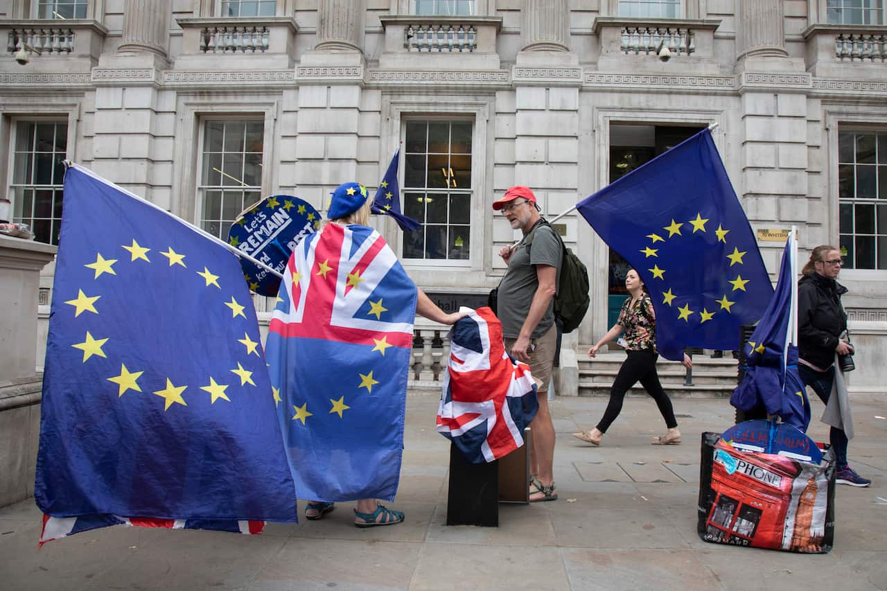 Anti Brexit protesters wave European Union flags outside the Cabinet Office in Westminster.