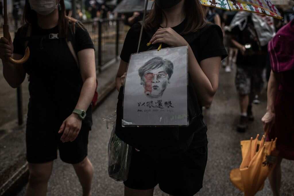 A Badiucao artwork featuring Hong Kong Chief Executive Carrie Lam and the caption: an eye for an eye.