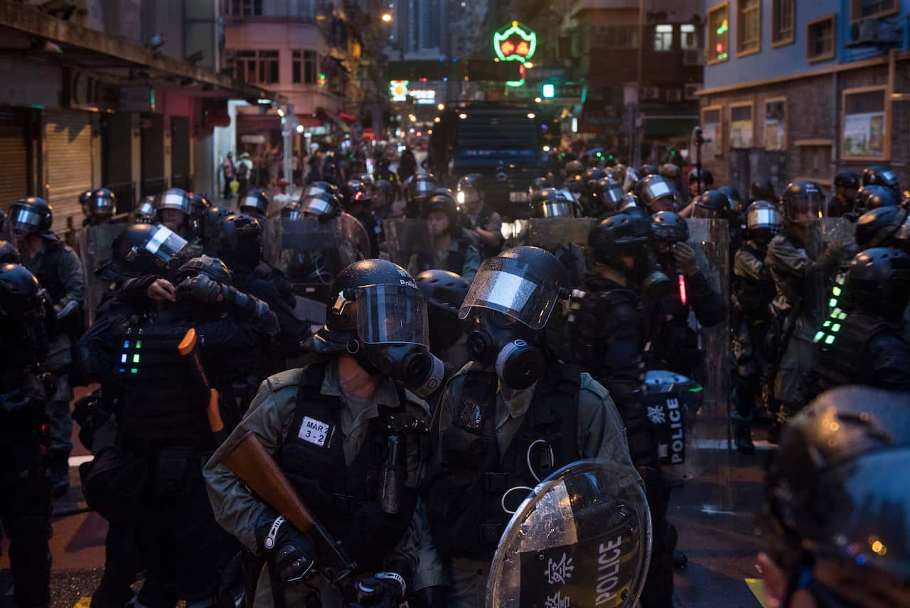 Riot police officers guard the streets during a protest in Hong Kong.