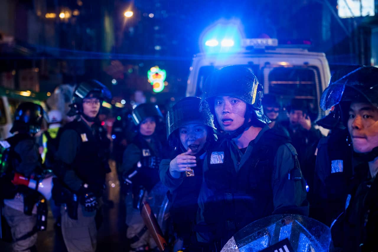 Riot police officers guard the streets during a protest in Hong Kong.
