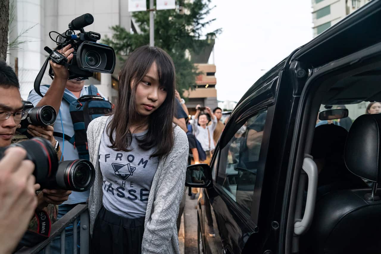 Hong Kong pro-democracy activist Agnes Chow leaves the Eastern Magistrates' Courts.