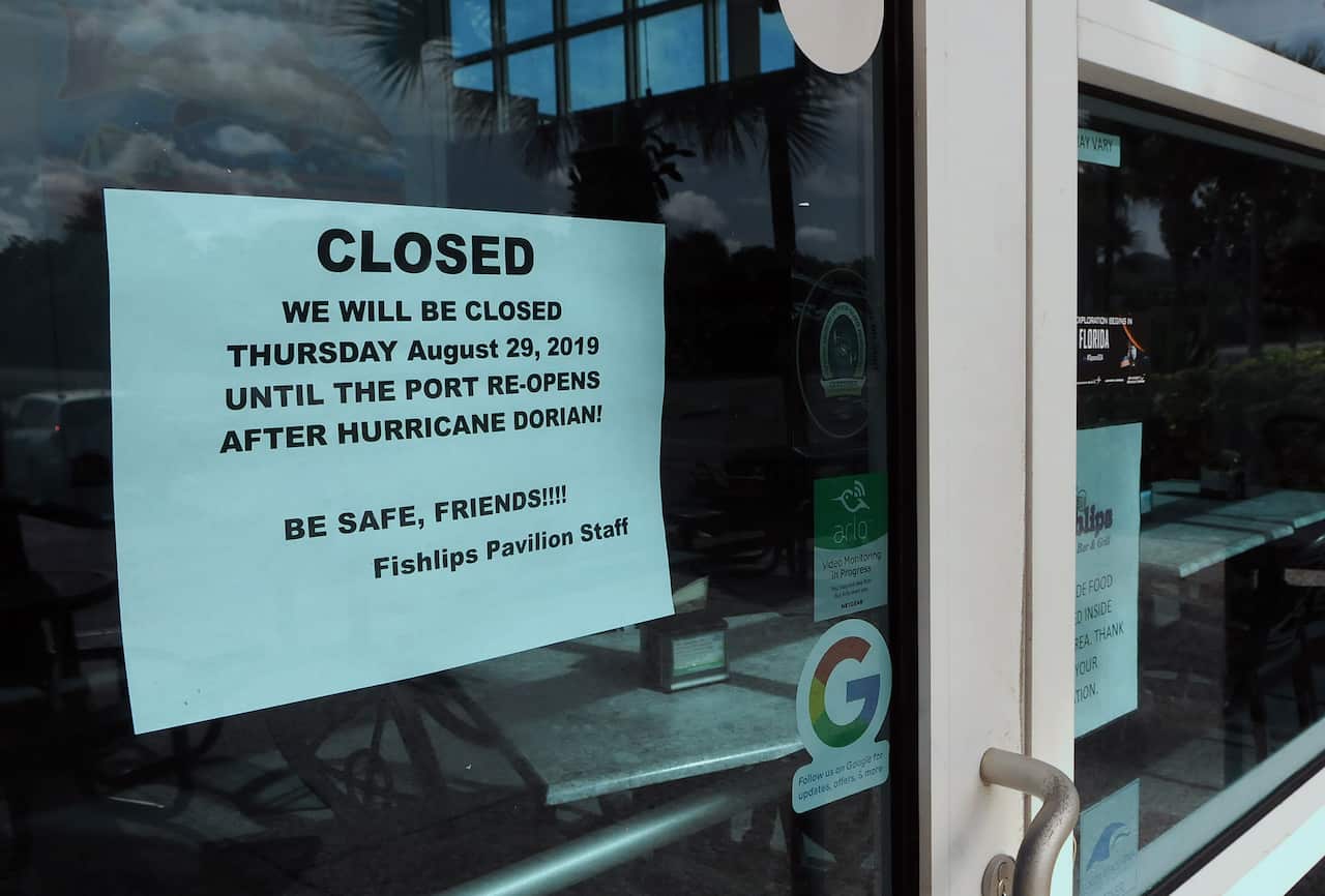 A notice is seen posted on the Fishlips Pavilion window at Jetty Park advising patrons that the restaurant will be closed due to Hurricane Dorian.