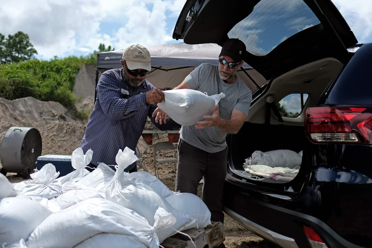 Residents load sandbags to protect their homes in Deltona, Florida, as they prepare for Hurricane Dorian.