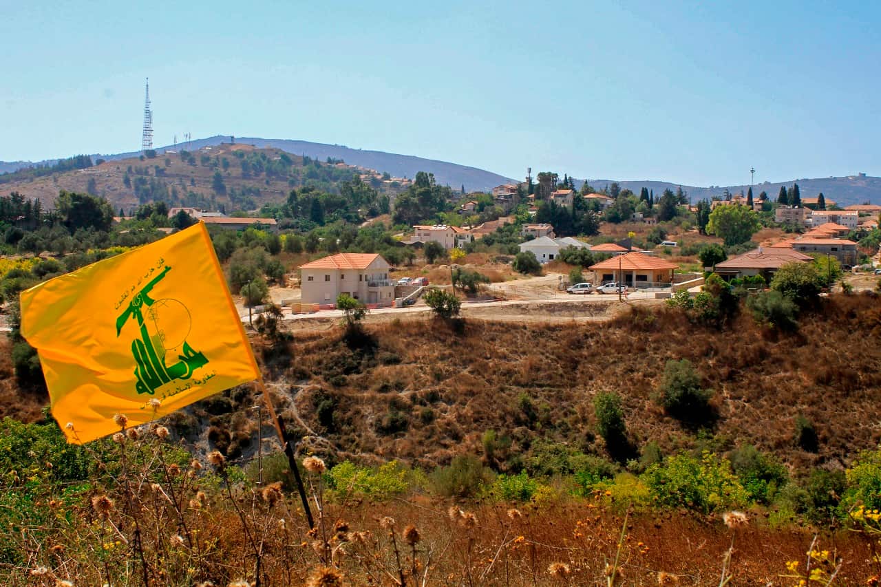 A Hezbolla flag flutters on the Lebanese side of the border with Israel.