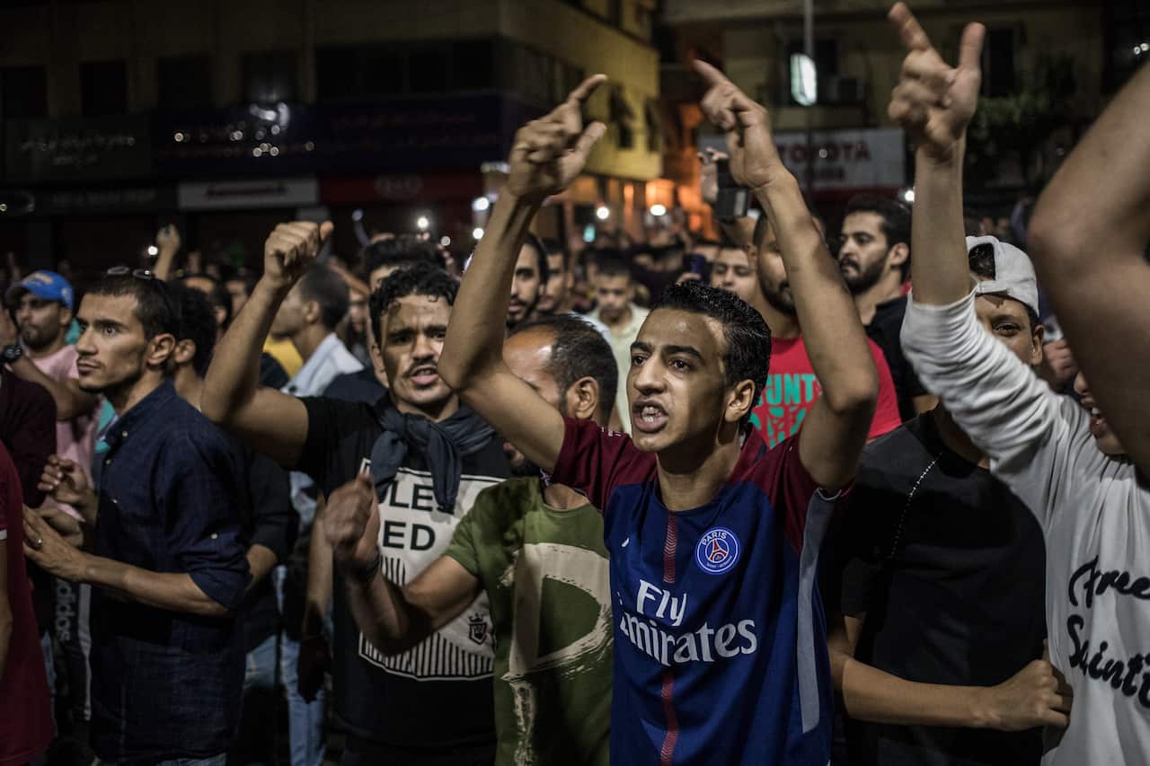Protesters shout slogans during a rare anti-government protest in Downtown Cairo.