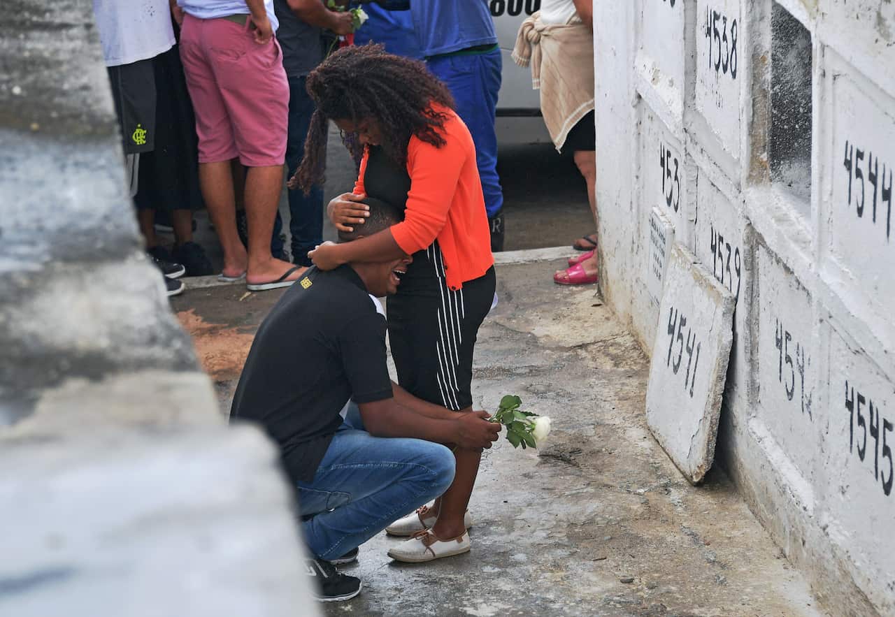 Relatives mourn during the funeral of eight-year-old Agatha Sales Felix, who was killed by a stray bullet during a police operation in Rio de Janeiro.