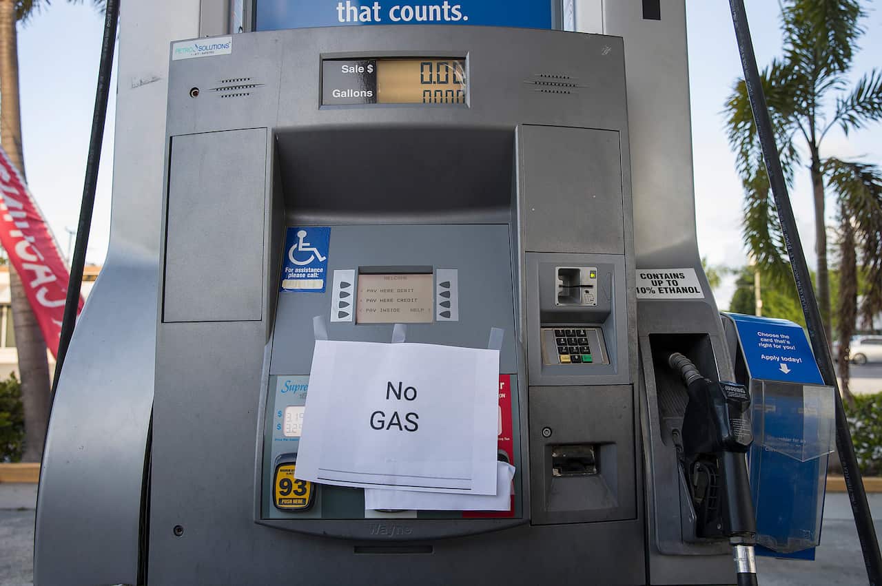 A 'No Gas' sign is seen on a gas pump at a station after it ran out of gas as people get fuel before the arrival of Hurricane Dorian.