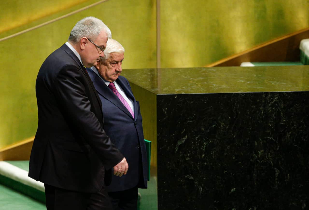 Syria's Foreign Minister Walid Muallem (R) arrives to speaks at the 74th United Nations (U.N.) General Assembly.