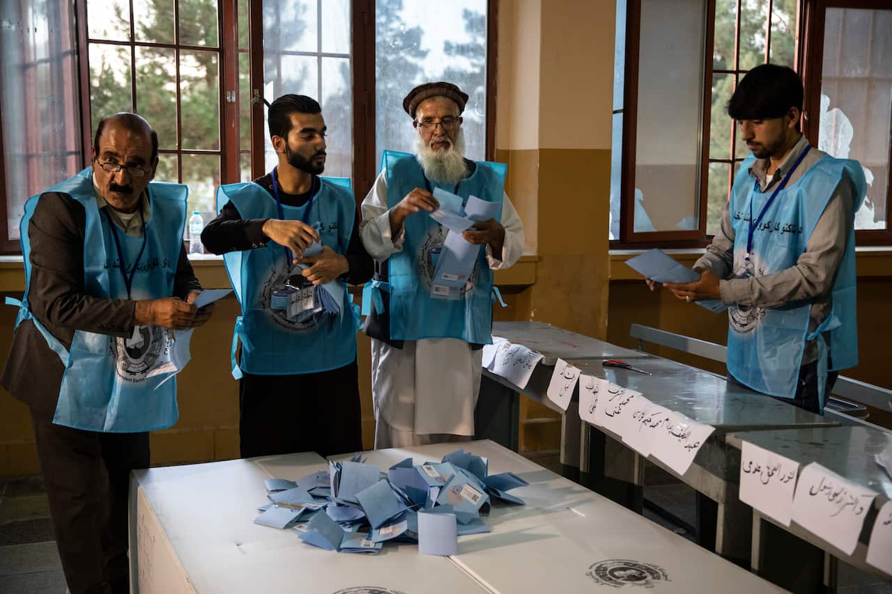 Afghan election workers start counting the ballots after light voter turnout and sporadic violence across the region.