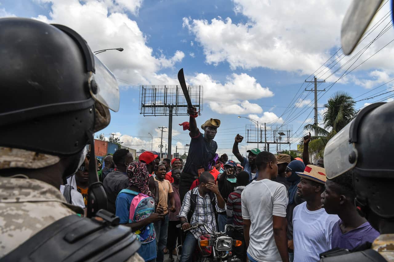 Demonstrators protest outside the United Nations' main base in Port-au-Prince, Haiti.