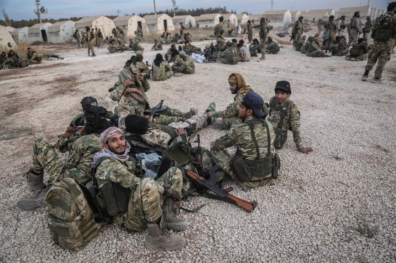 Soldiers and military vehicles are deployed at a staging area for the Turkish Armed Forces.