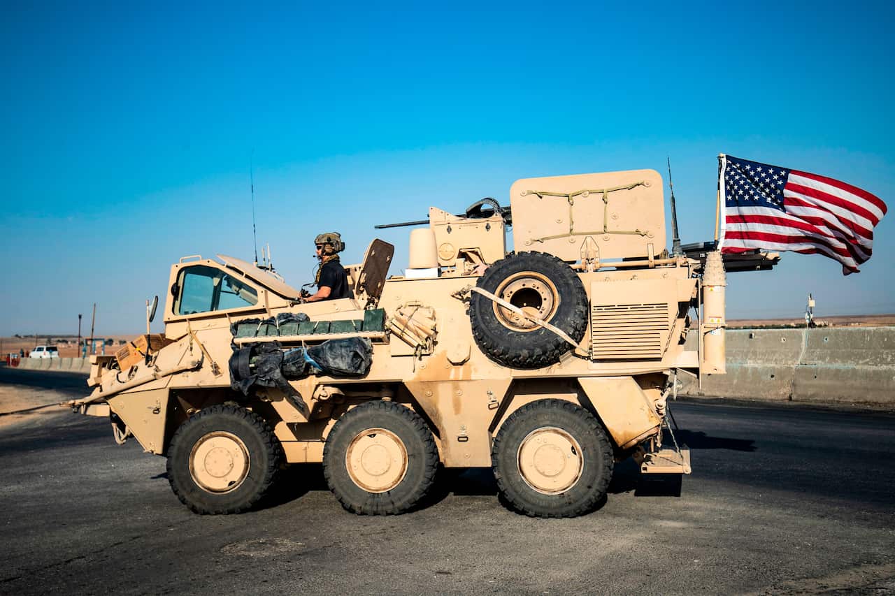 A US military vehicle patrols a road near the town of Tal Baydar in the countryside of Syria's northeastern Hasakeh province.