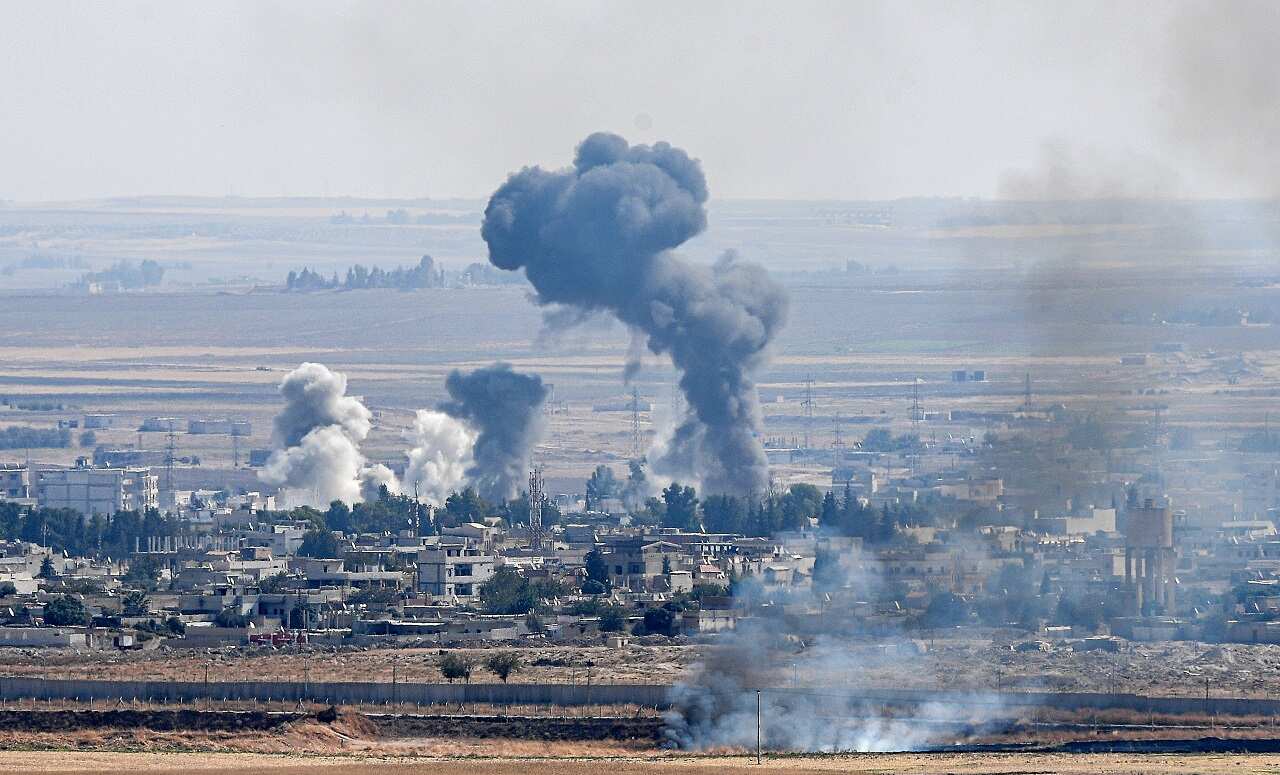 Smoke rises from the Syrian town of Ras al-Ain on Monday.