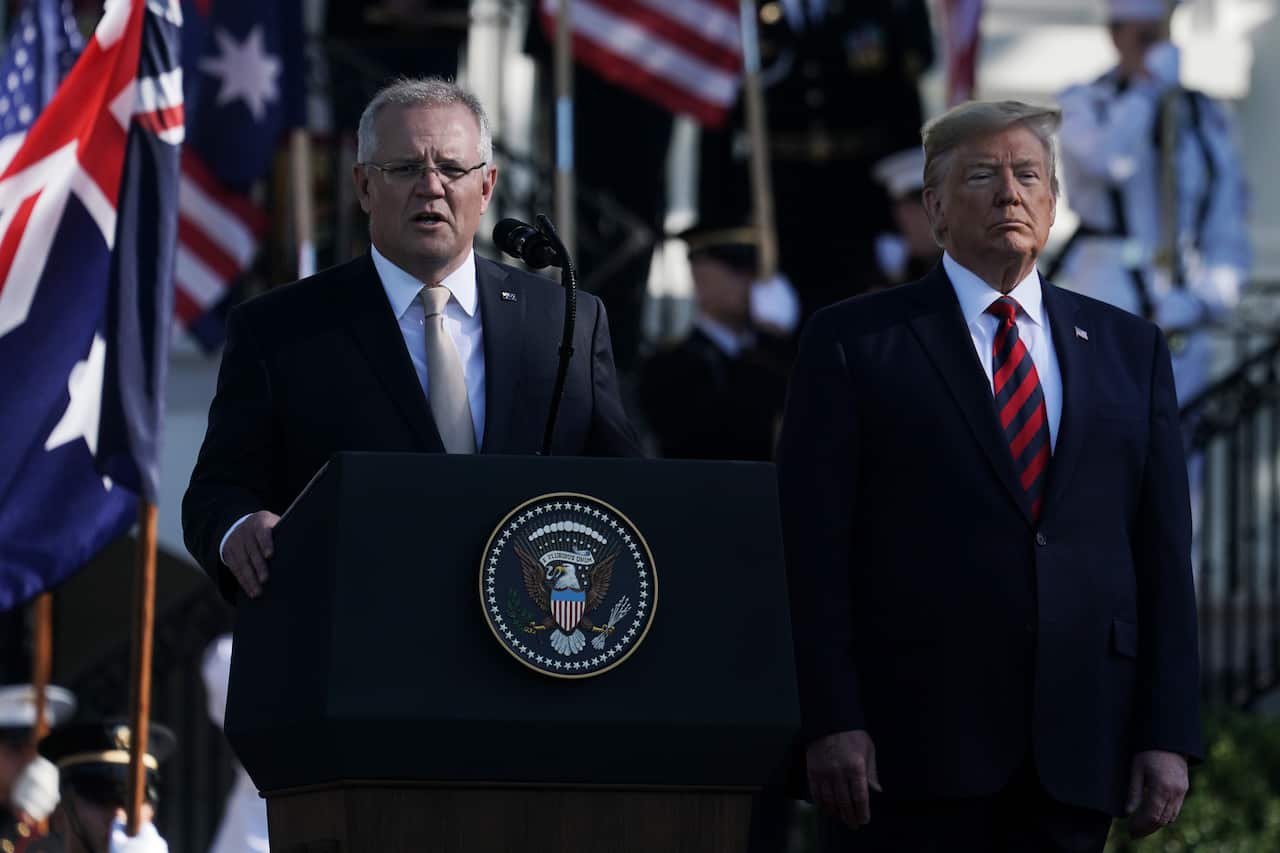 Prime Minister Scott Morrison speaks as U.S. President Donald Trump listens during an arrival ceremony at the South Lawn of the White House.