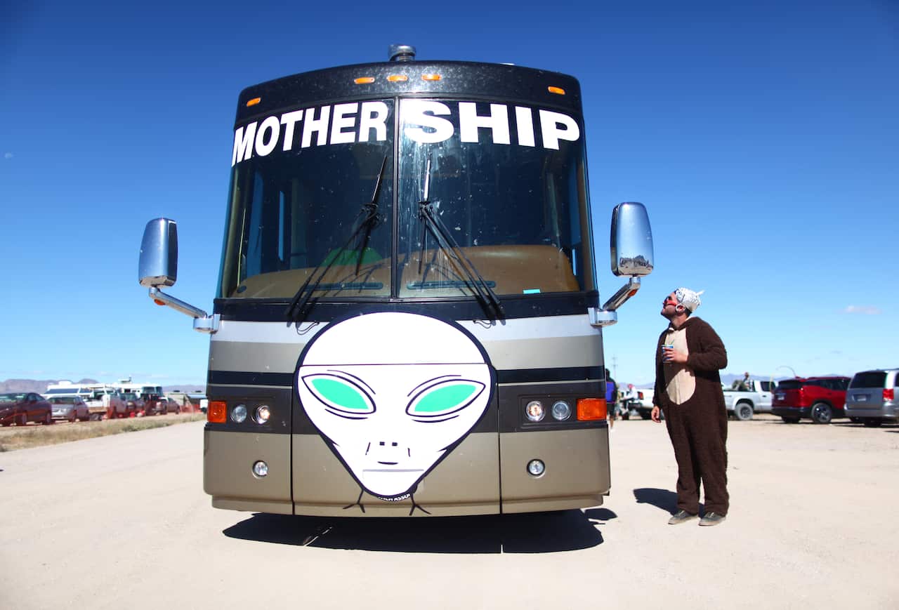 A bus arrives for a 'Storm Area 51' spinoff event in Rachel, Nevada.