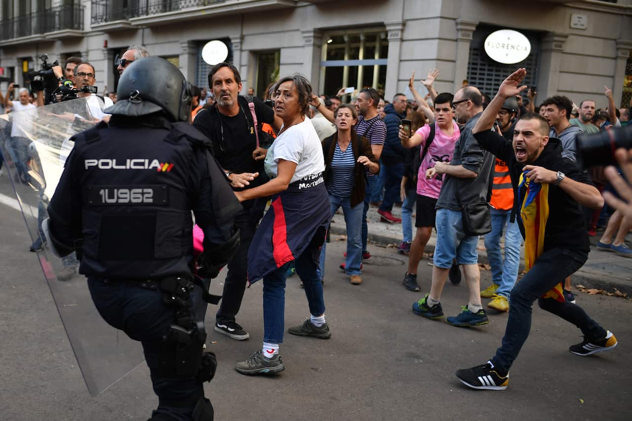 Police clash with protestors following a week of protests over the jail sentences given to separatist politicians by Spain’s Supreme Court.