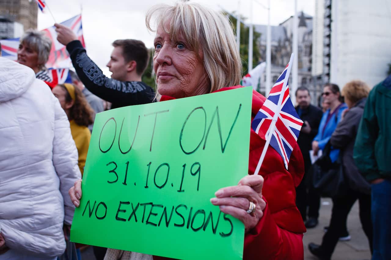 A pro-Brexit activist demonstrates in Parliament Square.