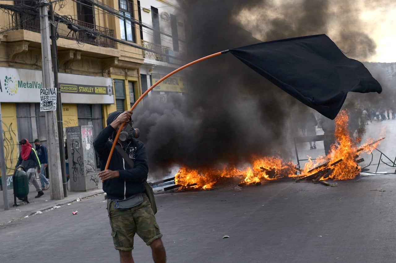 Demonstrators clash with security forces during a demonstration in Valparaiso, Chile.