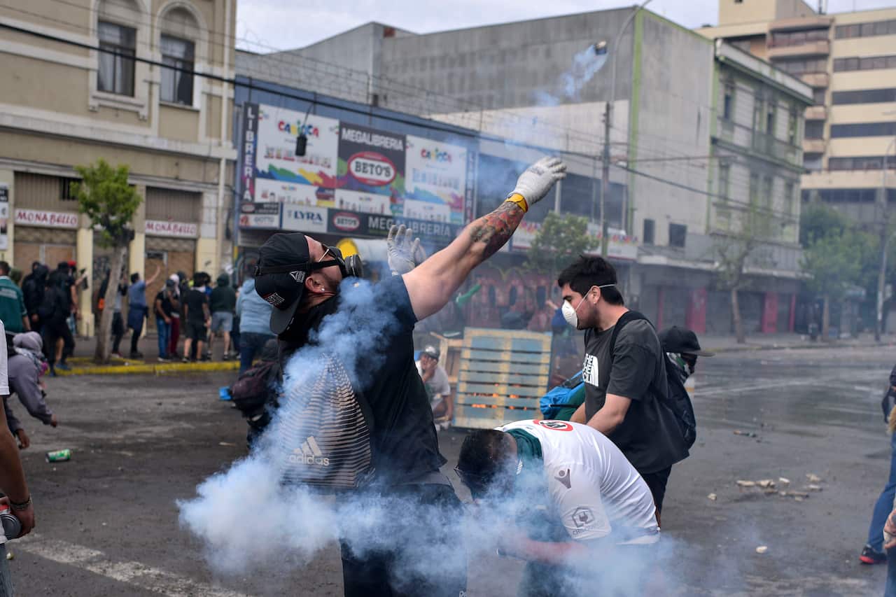 Demonstrators clash with security forces during a demonstration in Valparaiso, Chile.