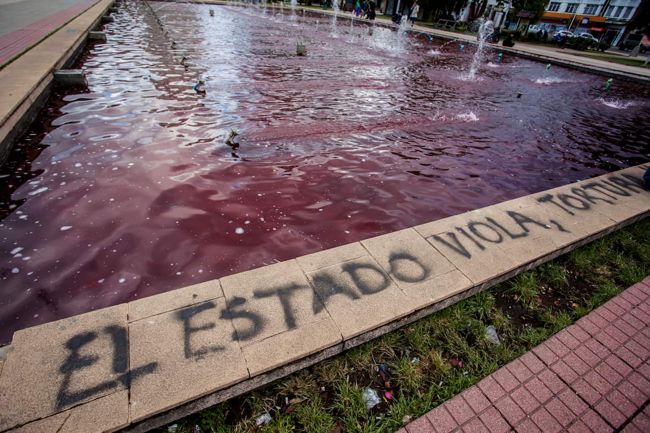 A public water feature is stained blood-red to remember those killed during protests throughout the country.
