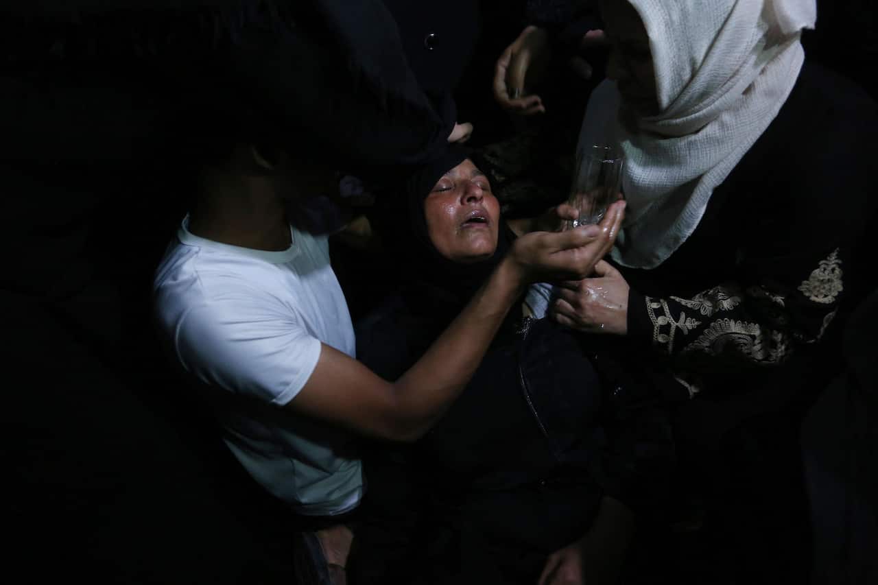 Relatives of Ahmed al-Shehri, 27, mourn over his body at the family house during his funeral in the town of Khan Younis, southern Gaza Strip.