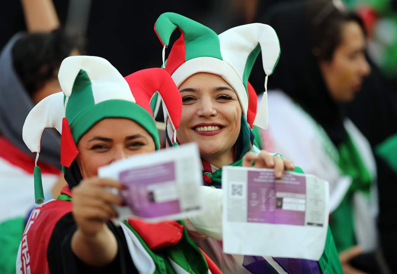 Iranian women show their tickets during the FIFA World Cup Qualifier match between Iran and Cambodia at Azadi Stadium.