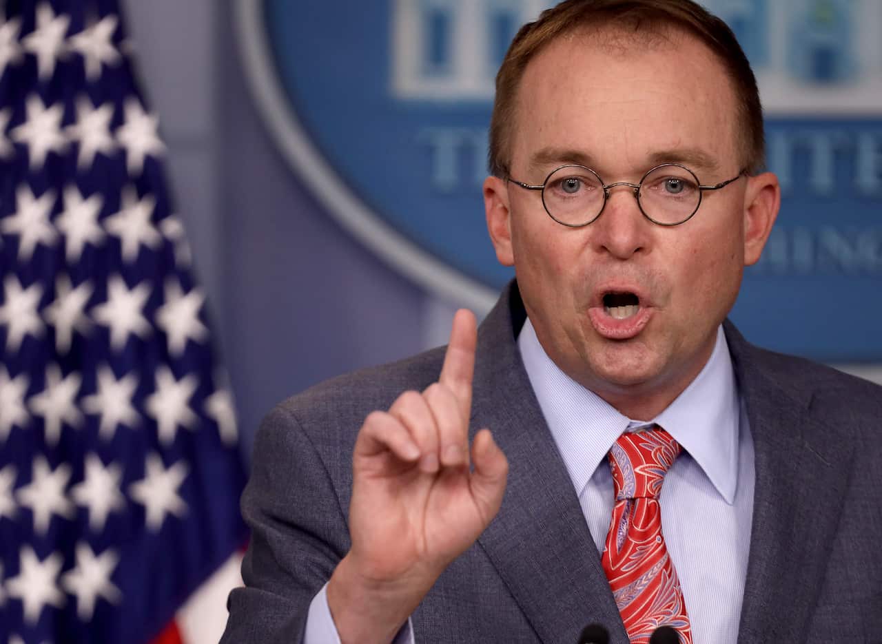 Acting White House Chief of Staff Mick Mulvaney answers questions during a briefing at the White House.
