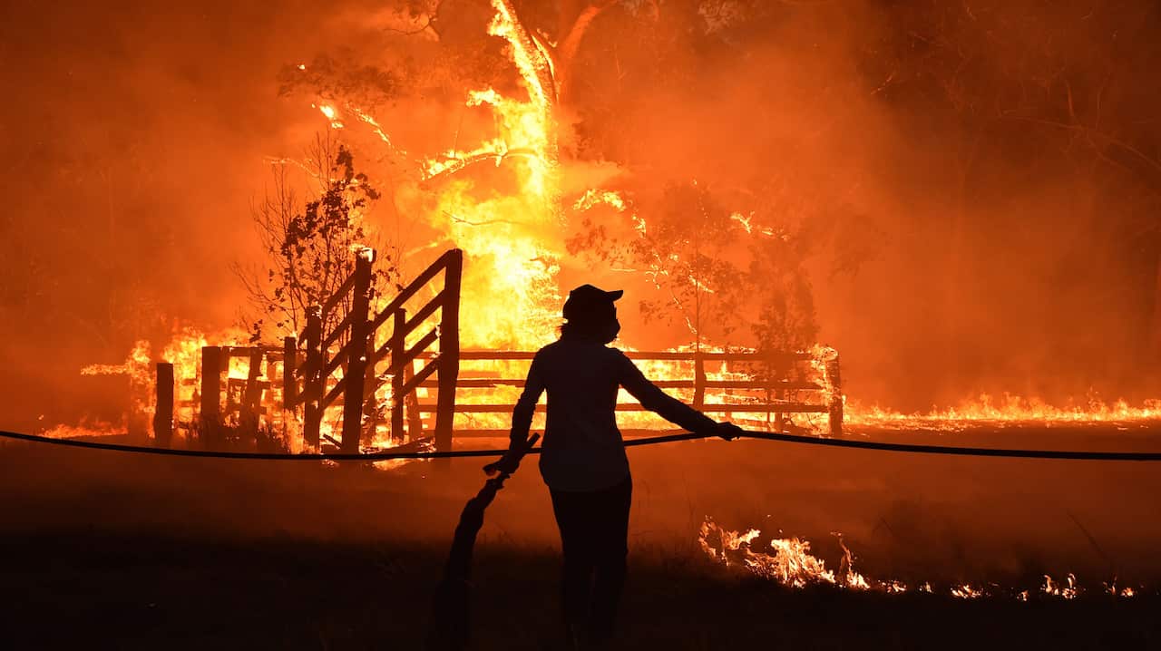 While this fire raged near his hometown of Taree, one volunteer firefighter was three hours north protecting other people's homes.