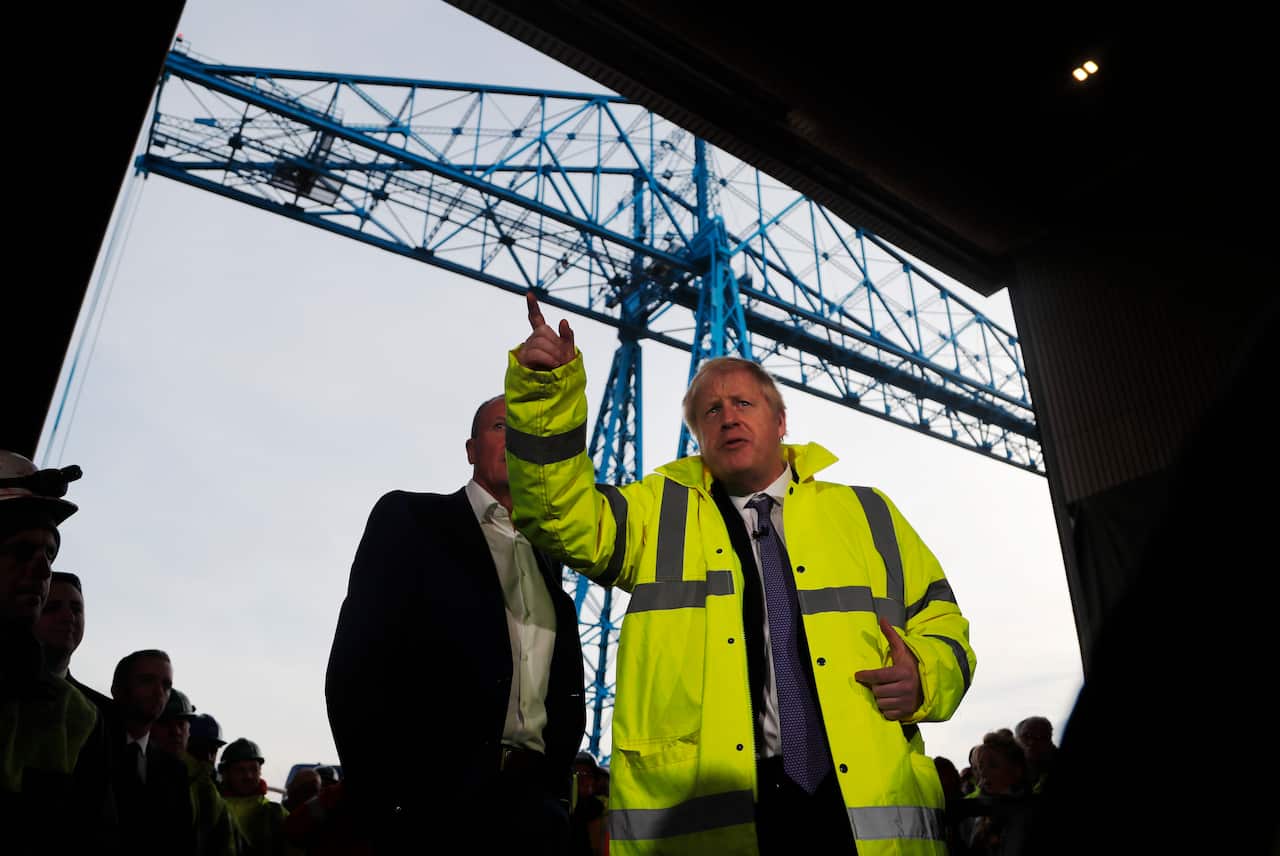 British Prime Minister Boris Johnson speaks to workers as he visits Wilton Engineering Services as part of a General Election campaign trail stop.
