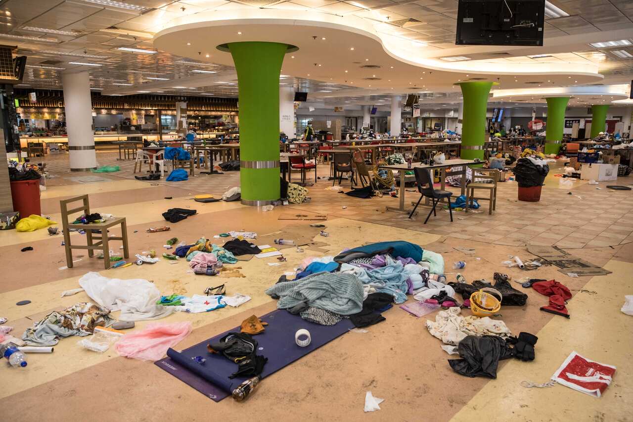 Belongings leftover from protesters who barricaded themselves on campus are seen in a canteen at the Hong Kong Polytechnic University.