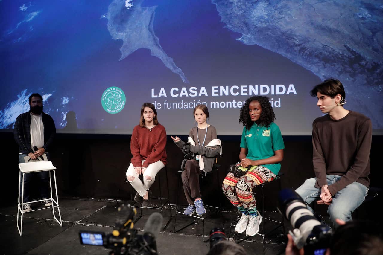 16-year-old climate activist Greta Thunberg (right 3) holds a press conference as she attends the 'March for Climate', demanding action against climate change.