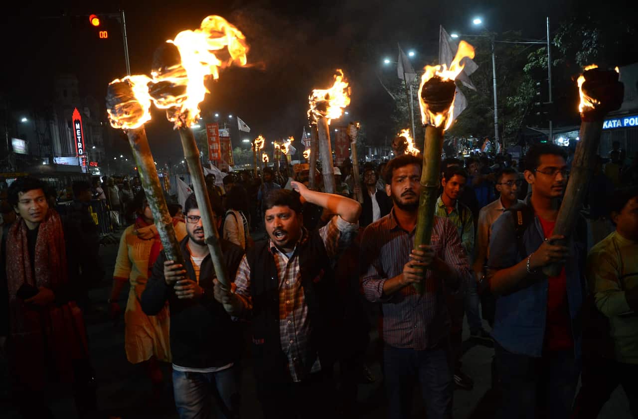 Activists  of various student organisations holding in a torch rally in Kolkata, India.