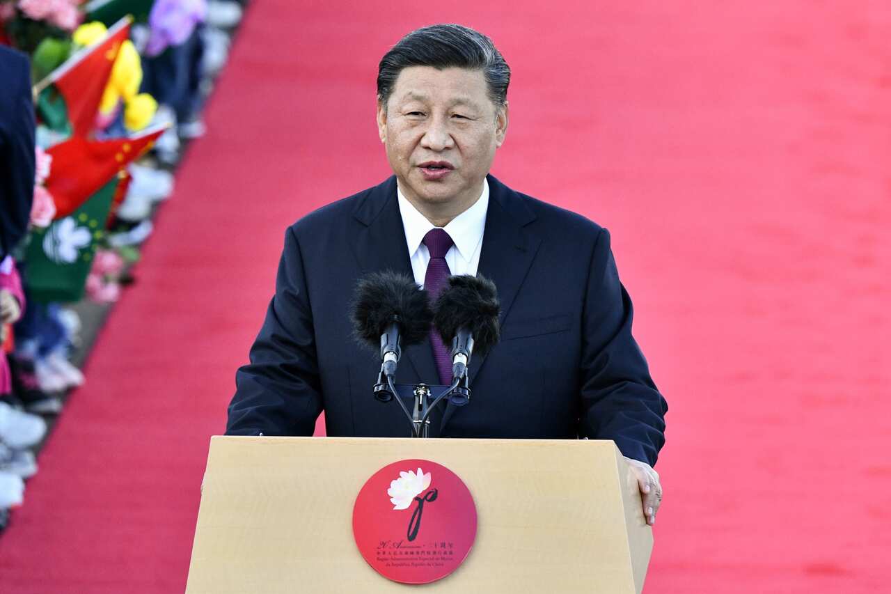 China's President Xi Jinping speaks upon his arrival at Macau's international airport.