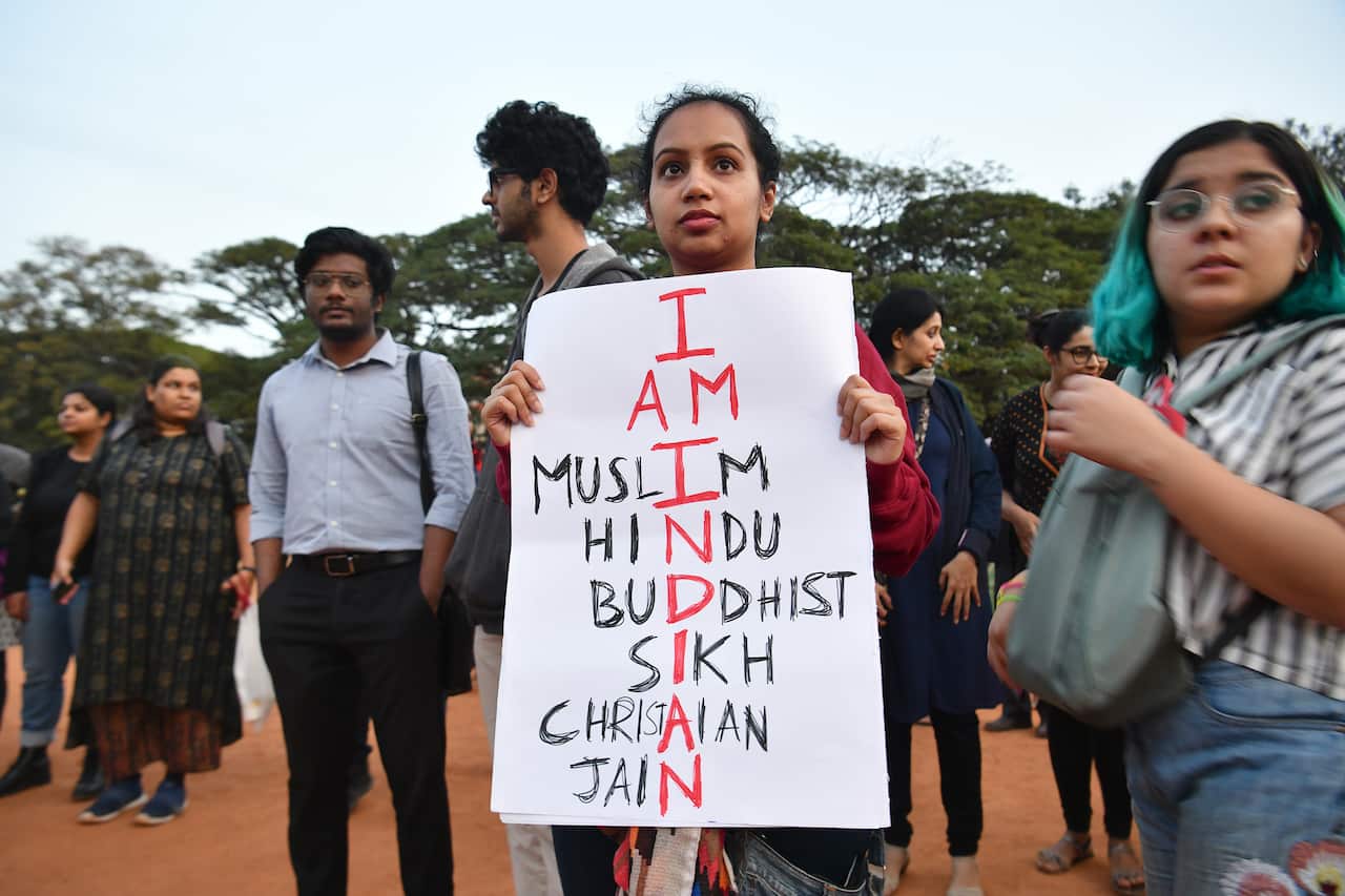 Protesters hold placards during a demonstration in Bangalore.