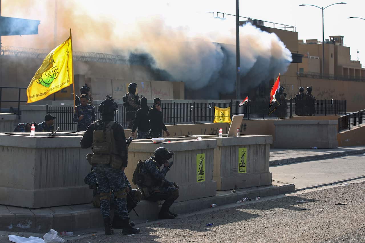 Iraqi security forces in front of the US embassy in Baghdad, after an order from the Hashed al-Shaabi paramilitary force to supporters to leave the compound.