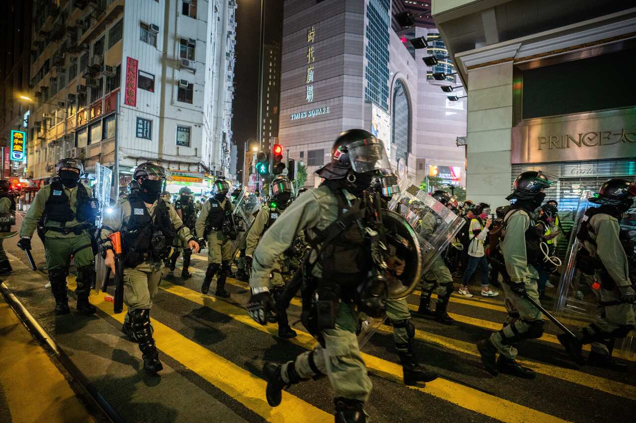 Hong Kong riot police officers in formation during the New Years Day pro-democracy demonstration.