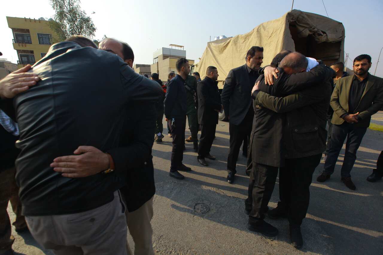 Mourners attend a funeral procession for Qassem Soleimani.