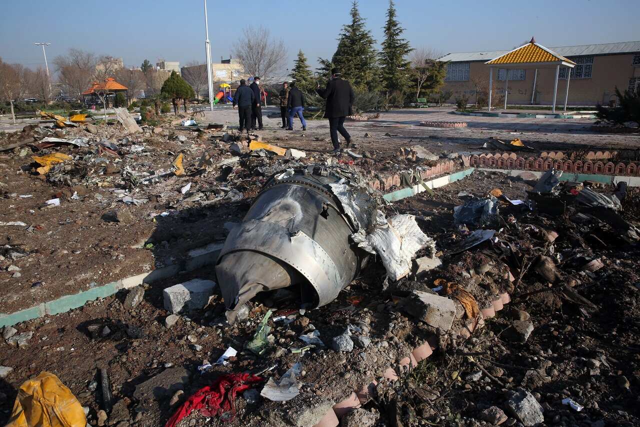 Rescue teams work amidst debris after a Ukrainian plane carrying 176 passengers crashed near Imam Khomeini airport in the Iranian capital Tehran.