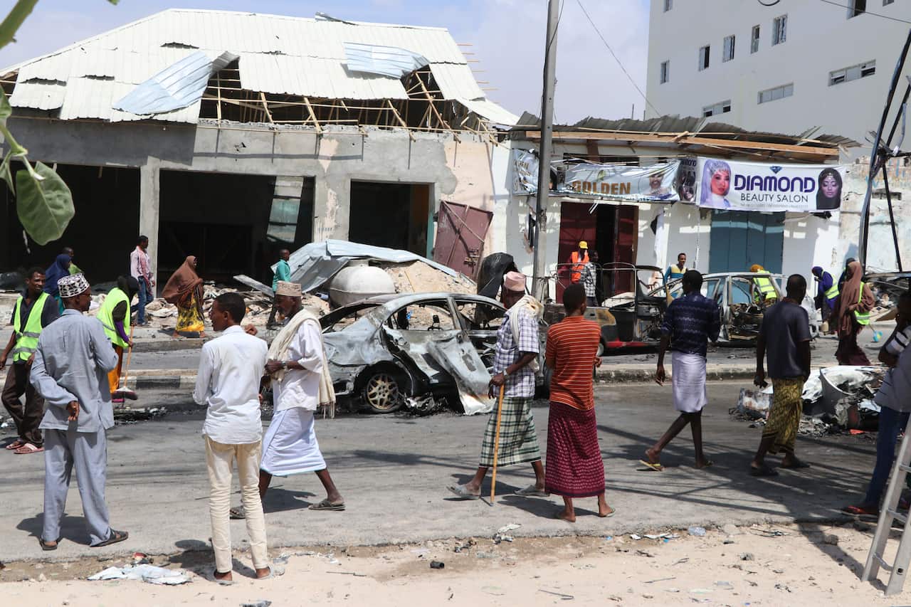 Damaged vehicles are seen after a car bombing near the Somali parliament building.