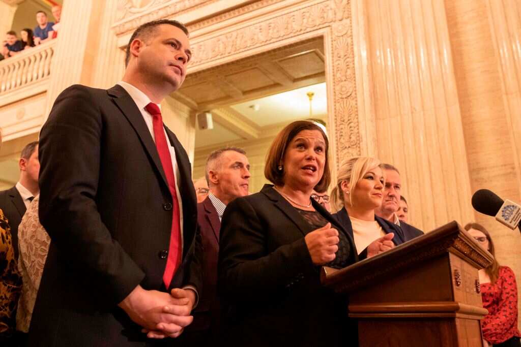 Irish republican Sinn Fein party leader Mary Lou McDonald (C) speaks flanked by deputy leader Michelle O'Neill (CR) and other colleagues.