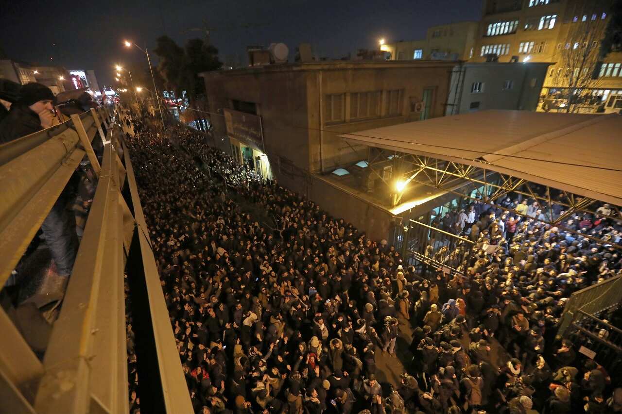 Iranians students demonstrate in Tehran following a vigil for the victims of the plane crash.