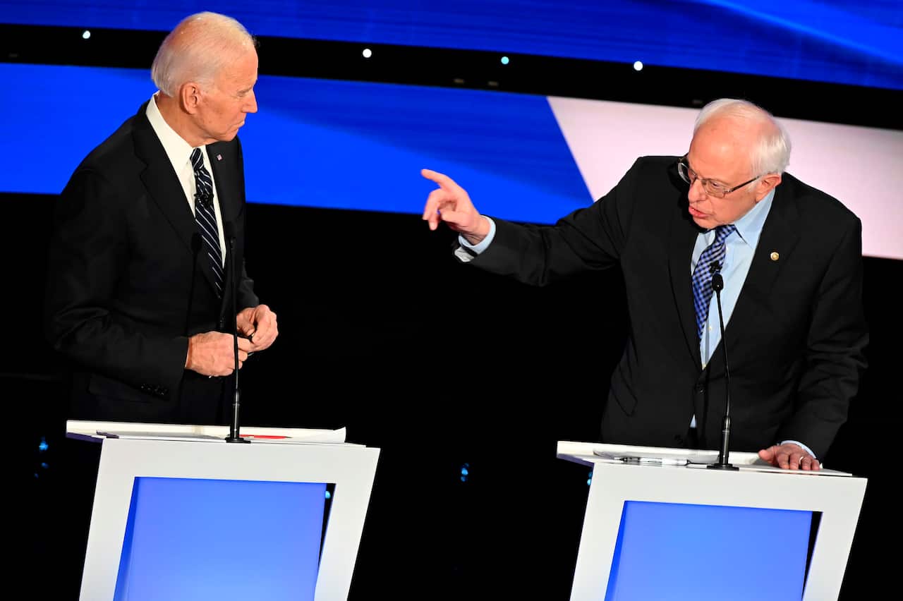 Democratic presidential hopefuls former Vice President Joe Biden (L) and Vermont Senator Bernie Sanders.