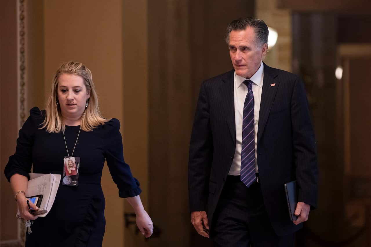 Sen. Mitt Romney (R-UT) returns to the Senate floor following a recess in the Senate impeachment trial of President Donald Trump.