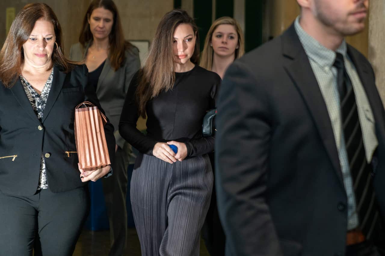 The prosecution's key witness Jessica Mann (C) arrives at Manhattan criminal court to testify at the sex assault trial of Harvey Weinstein.