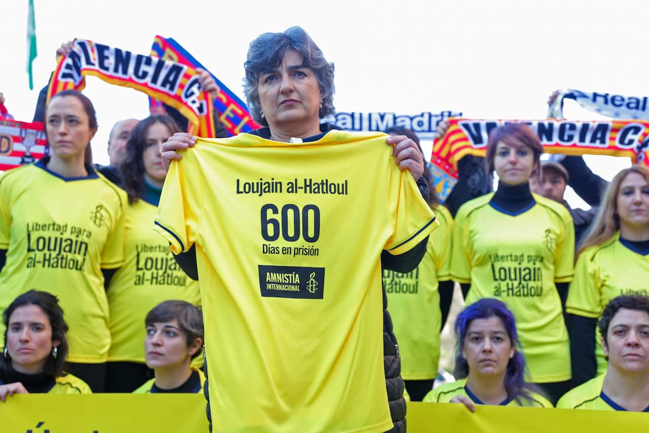 Amnesty International members protest in front of the Saudi Arabian embassy to demand the release of Loujain al-Hathloul.