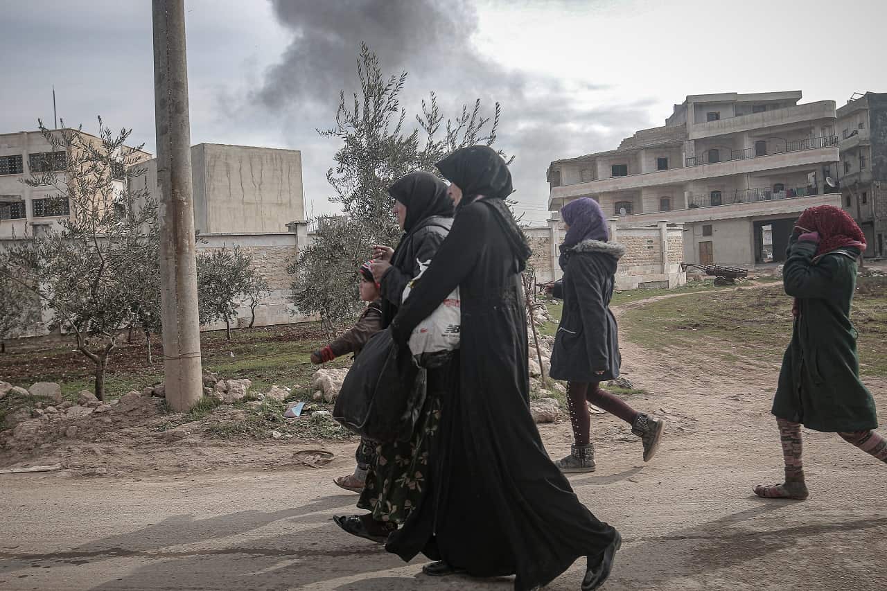 Families flee to safety in Idlib this week.