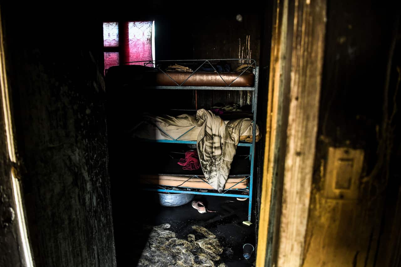 Burned remains are seen in a room inside the Orphanage of the Church of Bible Understanding.